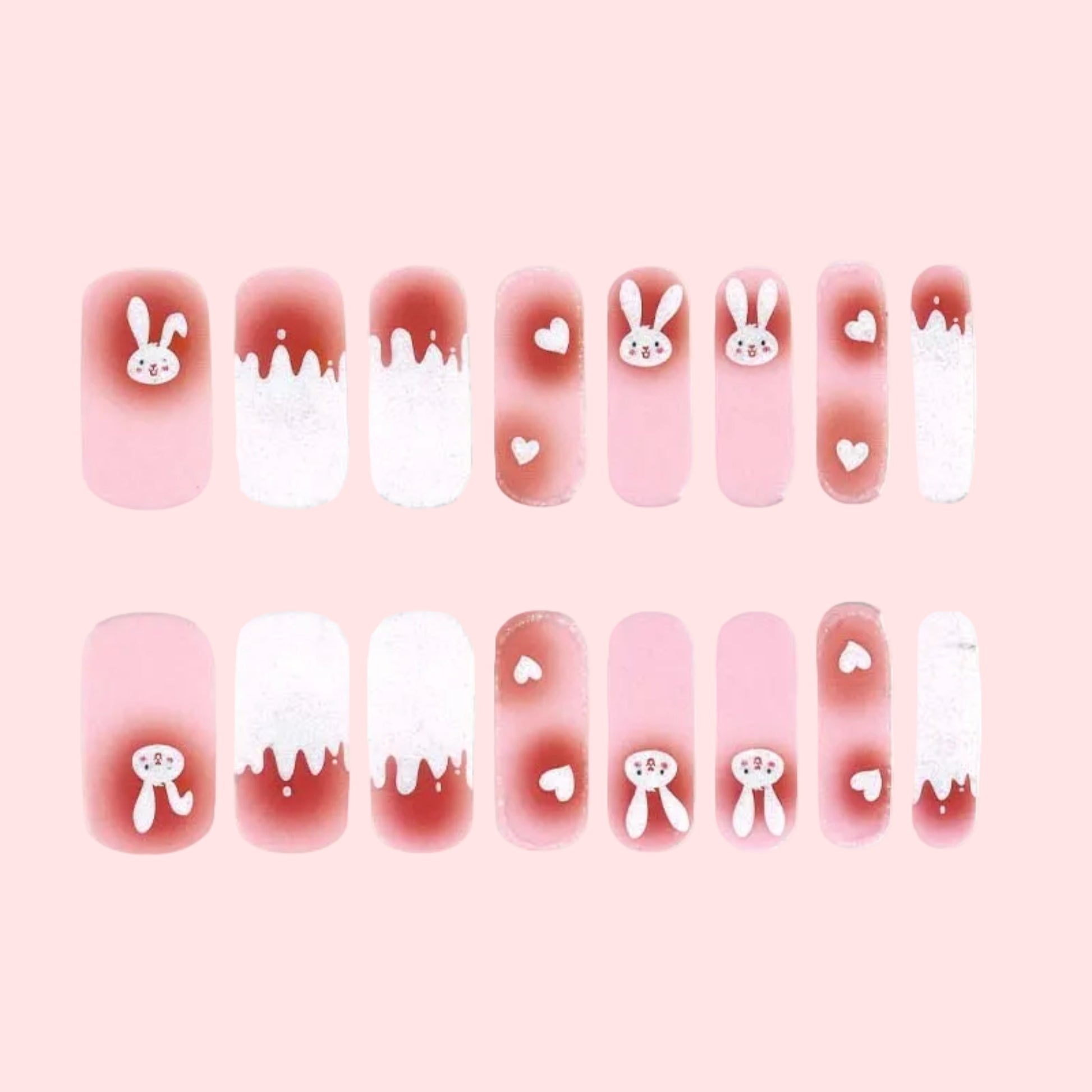 Set of nail art stickers with bunny and heart designs on a white background
