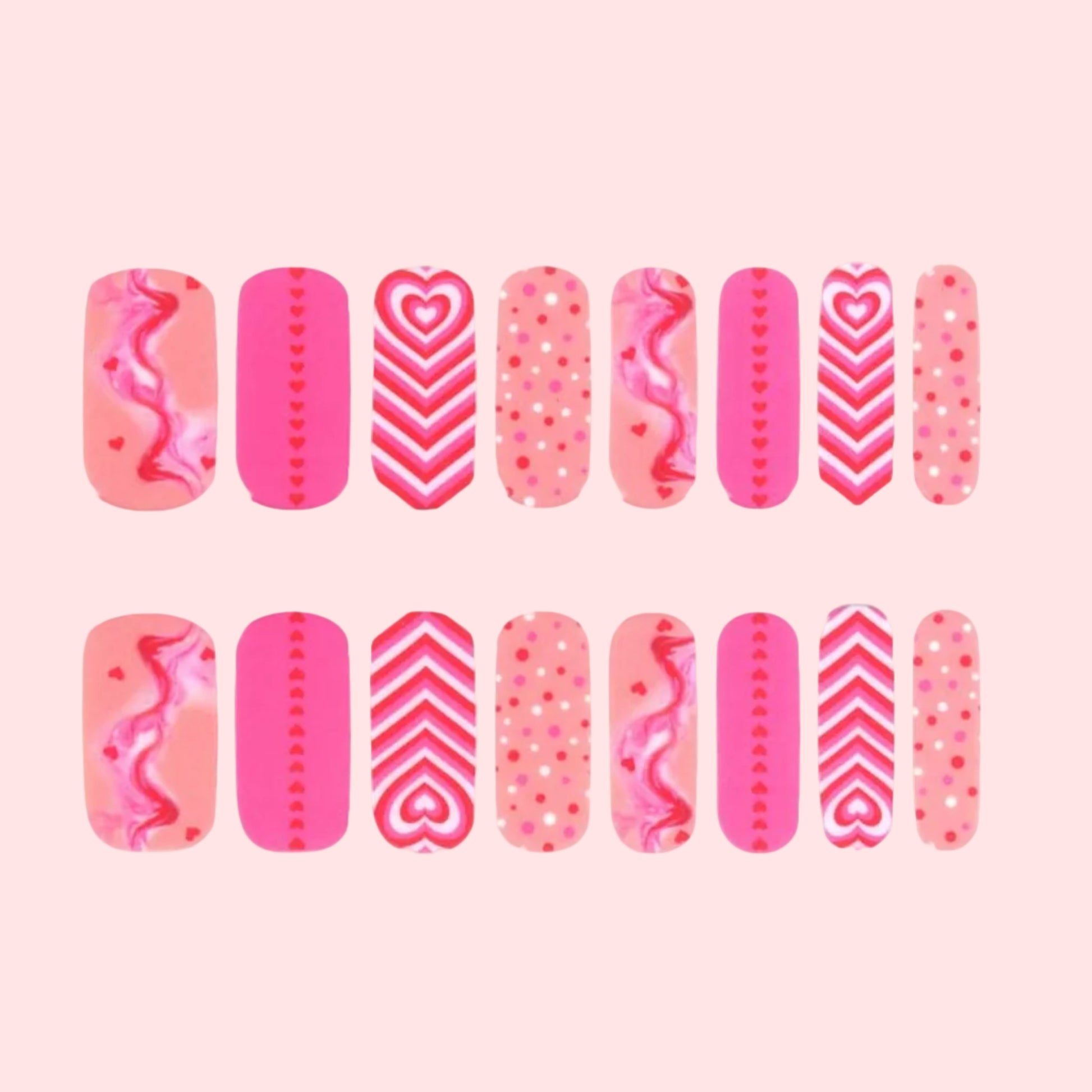 Set of pink nail wraps with various patterns on a white background